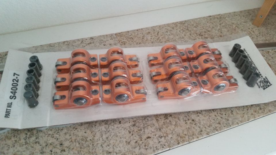 Orange aluminum roller rocker arms in packaging with part number S4002-7