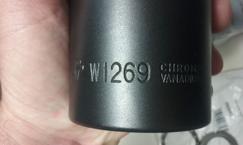 1995 Ford Bronco - A close-up shot shows a black socket with the markings "W1269 CHROME VANADIUM" embossed on its side, held by a person's hand.
