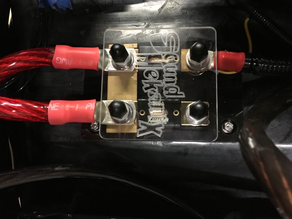 SoundKranx fuse holder with two red power cables connected.