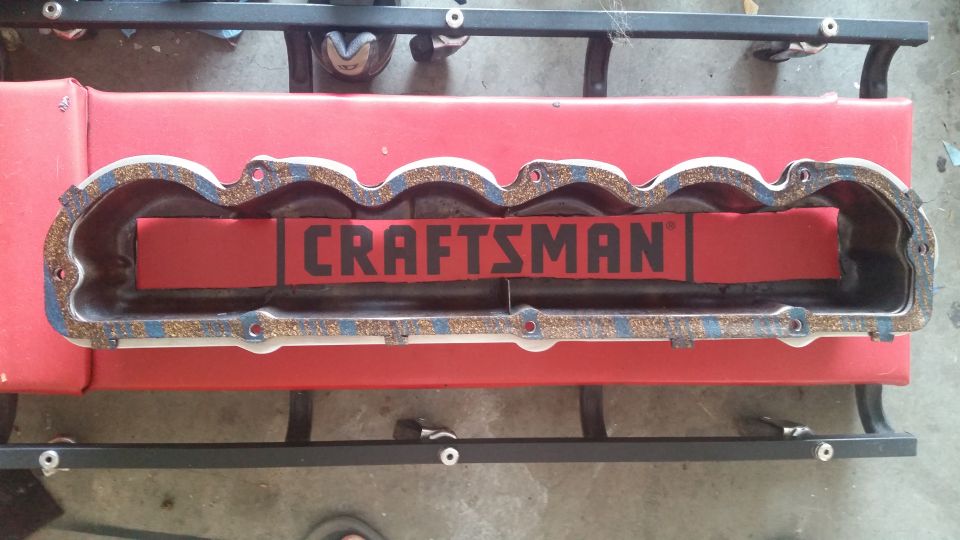 Valve cover gasket with CRAFTSMAN logo on red insert.