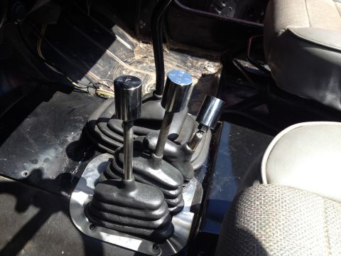 1995 Jeep YJ - Transfer case shifter linkage components visible in detail.