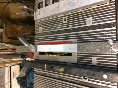 1995 Jeep Wrangler - The image shows a close-up view of a table saw with a yellow saw blade visible. There are clamps attached to the saw, and the background ap…