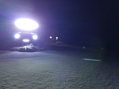 1995 Jeep Wrangler - Jeep YJ driving in snow at night with auxiliary lights on.