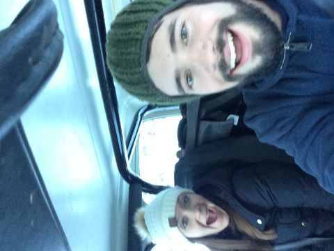 1995 Jeep Wrangler - Two individuals smile for a selfie from inside a vehicle during a winter outing.