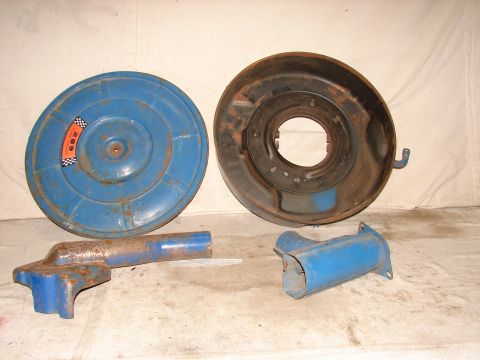 1973 Ford Ranchero - Two blue metal car parts, an air cleaner lid and base, are shown with some rust and wear.