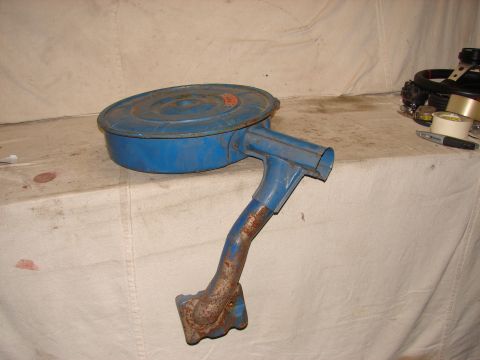 1973 Ford Ranchero - This is a blue air cleaner assembly, likely for an older vehicle, with visible rust on the mounting bracket.