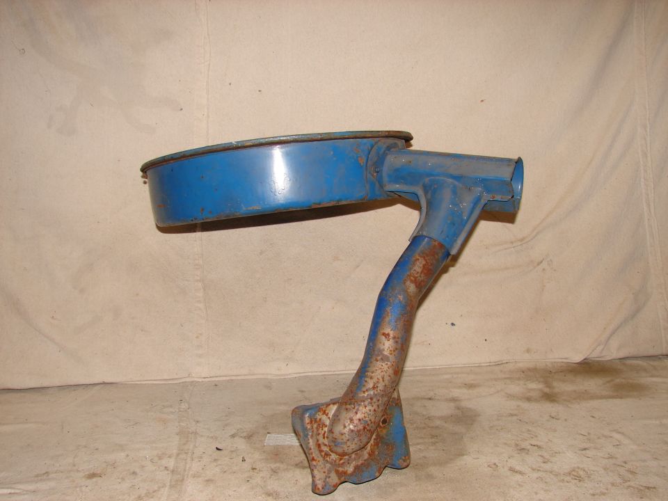 Blue metal air cleaner assembly with rusted mounting bracket and bent intake tube