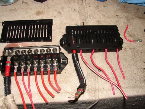 1973 Ford Ranchero - Two automotive fuse boxes, one with eight slots and the other with ten, are shown with connected red wires and visible amperage ratings.