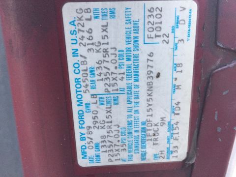 1989 Ford F-150 - Vehicle identification sticker shows manufacturing date of 05/89 and VIN 1FTDF15Y5KNB39776.
