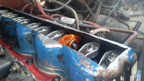 1981 Ford Bronco - Close-up of an engine's valve train, showing the rocker arms and valve covers.