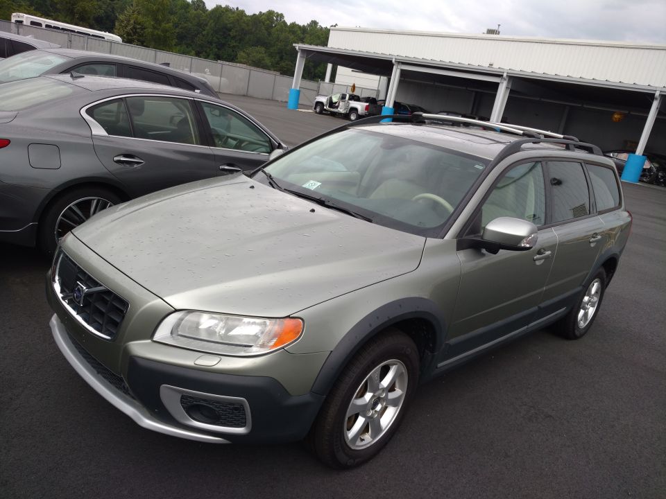 Silver Volvo XC70 wagon parked outdoors, front quarter view