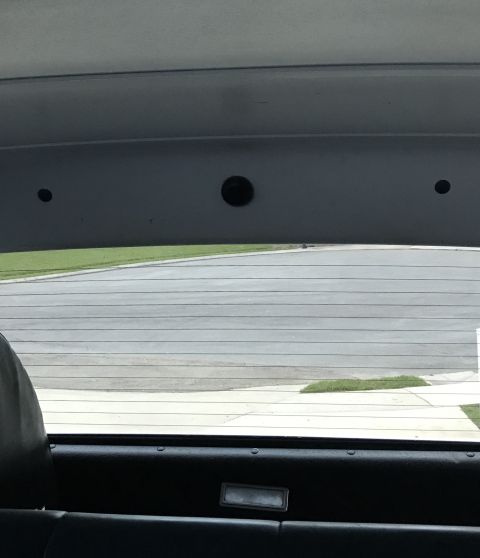 1995 Ford Bronco - View from inside the vehicle looking out the rear window, with a watermark visible on the lower right.
