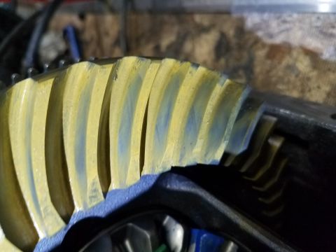 1995 Ford Bronco - This photo shows a close-up view of a differential ring gear, likely indicating wear or lubrication patterns.
