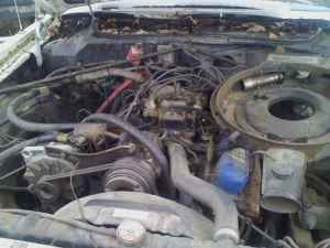 2001 Ford Crown Victoria - Close-up view of a car's engine bay, showing various components and wiring.