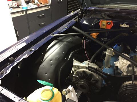 2001 Ford Crown Victoria - Engine bay detail with alternator and inner fender liner visible.