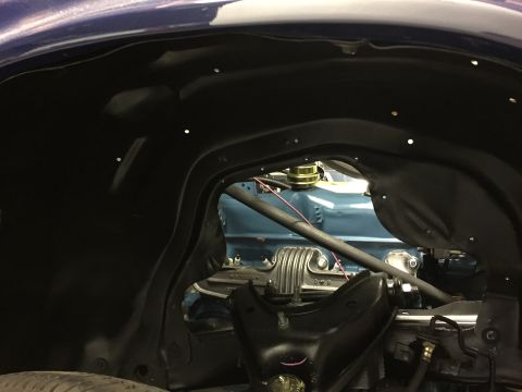 2001 Ford Crown Victoria - View into the wheel well reveals the engine and suspension components.