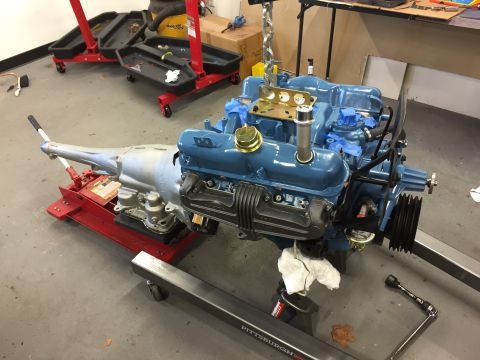 2001 Ford Crown Victoria - Engine and transmission assembly on a stand in a workshop setting.