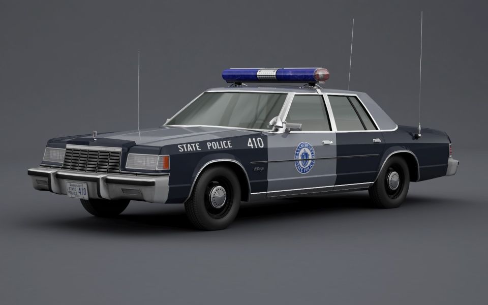 Police car with light bar on top, marked "STATE POLICE 410" and a circular badge