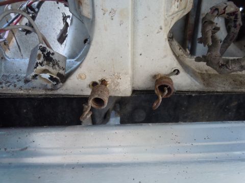 2001 Ford Crown Victoria - Close-up view of corroded springs and electrical components.