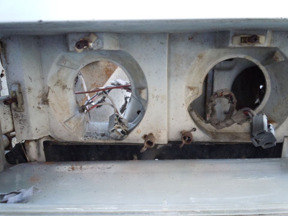 Headlight housing with wiring and empty sockets