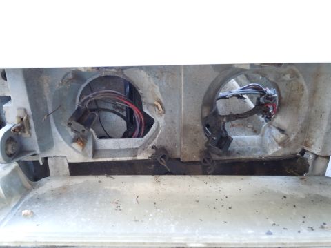 2001 Ford Crown Victoria - The wiring for the headlights appears to be damaged and exposed.