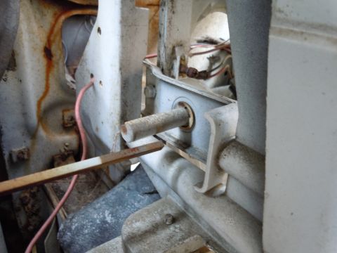 2001 Ford Crown Victoria - Detail of a mechanical component within a vehicle, showing a rod and wiring harness.