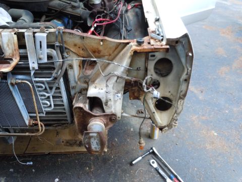 2001 Ford Crown Victoria - Front end of a vehicle disassembled for repair, with engine components and radiator exposed.