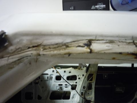 2001 Ford Crown Victoria - Interior view of a 2001 Ford Crown Victoria undergoing restoration, revealing structural damage.