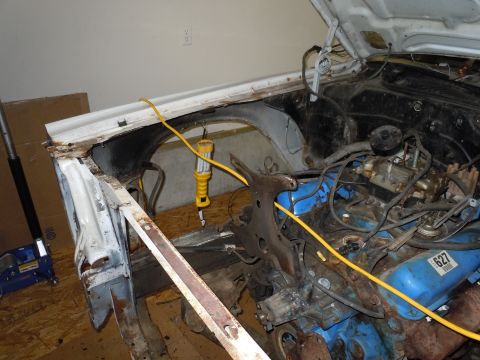 2001 Ford Crown Victoria - Work in progress on a car's engine bay, showing blue valve covers and exposed components.