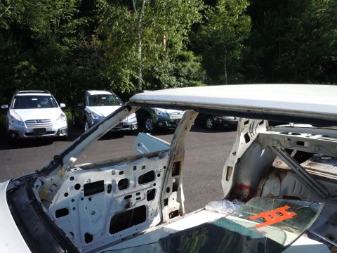 2001 Ford Crown Victoria - Interior of a stripped vehicle with other cars parked in the background.