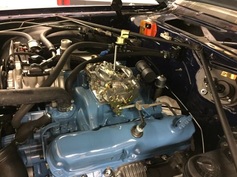 2001 Ford Crown Victoria - Close-up view of a vehicle's engine bay, showing various components and wiring in detail.