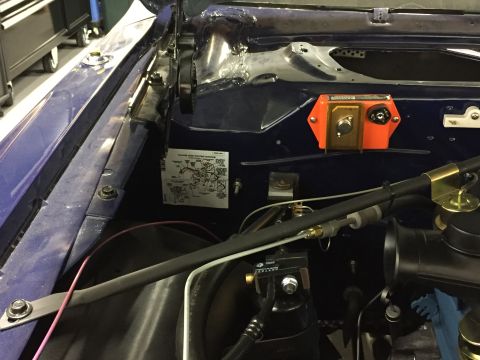 2001 Ford Crown Victoria - Close-up of a vehicle's engine bay, a wiring diagram sticker and electrical components.