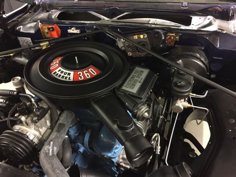 2001 Ford Crown Victoria - Close-up view of a vehicle's engine bay, highlighting the air intake and electronic fuel control system.