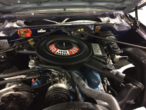 2001 Ford Crown Victoria - Close-up view of the engine bay, highlighting the air cleaner and electronic fuel control system.