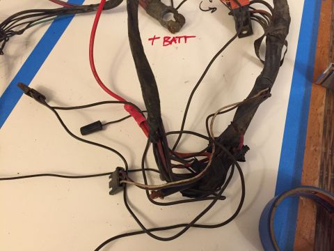 2001 Ford Crown Victoria - A tangled automotive wiring harness is laid out on a surface, with some wires marked by hand.
