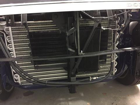 2001 Ford Crown Victoria - Close-up view of a vehicle's front cooling system components.