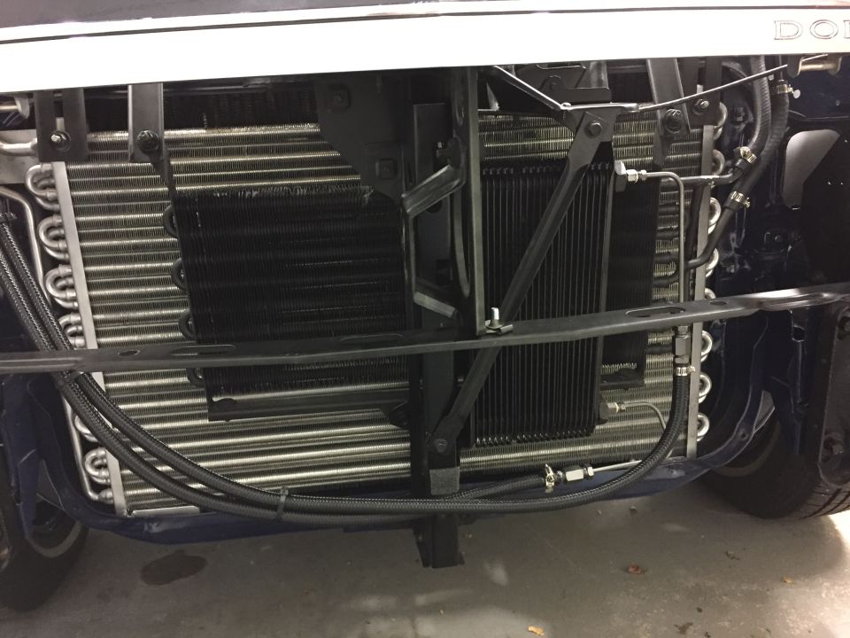 Vehicle radiator and cooling system with visible hoses and metal fins