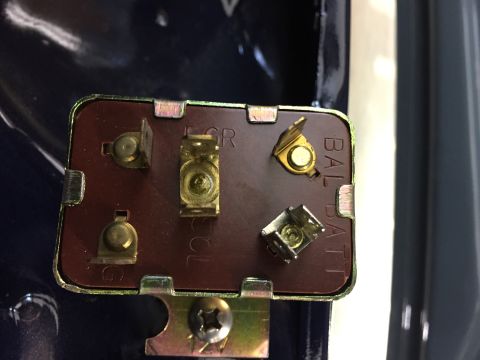 2001 Ford Crown Victoria - Close-up of an electrical relay with visible terminal markings.