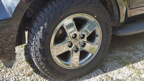 2007 Dodge Durango - Close-up of a chrome wheel and tire on a vehicle, with a visible Ram logo on the wheel.