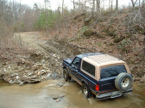 1987 Ford Bronco - This 1987 Ford Bronco is navigating a water crossing on an off-road trail.