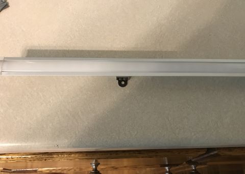 1995 Ford Bronco - RV overhead cabinet interior showing a light fixture and mounting hardware, with Supermotors.net watermark.