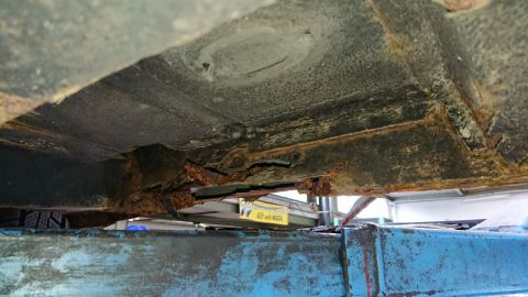 1999 Ford Fairlane - Severe rust damage is visible on the undercarriage and frame rails of this vehicle.