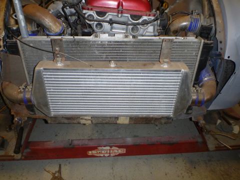 1969 MINI Cooper - Close-up view of a vehicle's engine bay, focusing on the intercooler and radiator assembly.