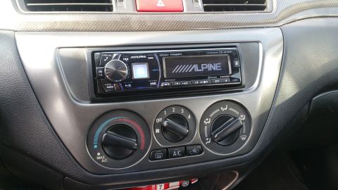 2006 Mitsubishi Evolution - Close-up of the car's center console, showing the stereo and HVAC controls.