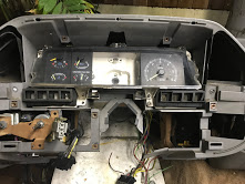 1988 Ford Bronco - Interior view of a vehicle's dashboard with exposed wiring and gauges.