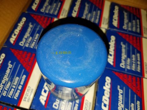 2000 Ford Crown Victoria - A blue ACDelco oil filter is shown with its packaging, which indicates it is a Duraguard model PF2057.