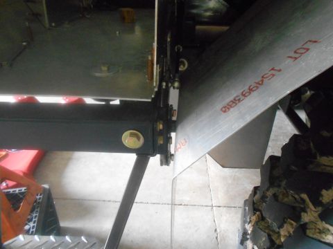 1992 Ford Bronco - Close-up view of a vehicle's underbody, showing a metal plate with lot number 15499388.