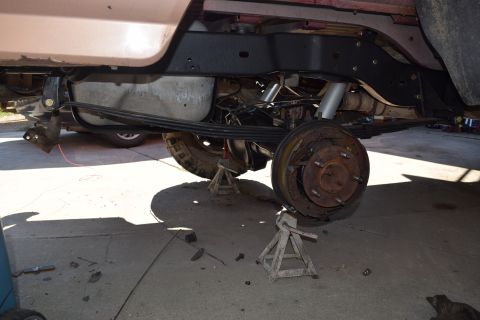 1995 Ford Bronco - Rear suspension work on a 1995 Ford Bronco, showing the axle and leaf springs.