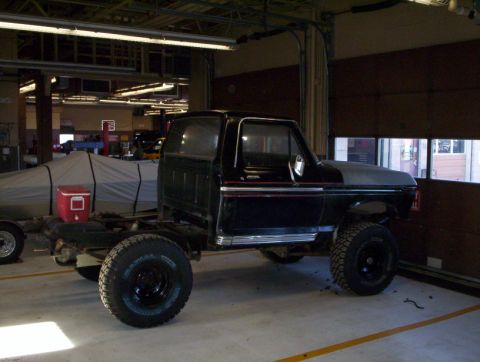 1978 Ford Bronco - This Ford F-Series truck chassis, likely from the 1970s, is undergoing modifications in a workshop.