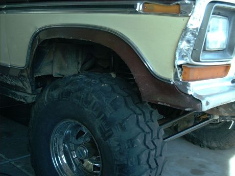 1979 Ford Bronco - This photo shows the front fender and wheel well of a lifted Ford Bronco, likely from the late 1970s.